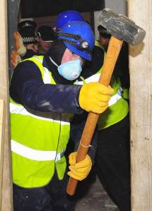 COPS SMASH THEIR WAY INTO JACONELLI HOME