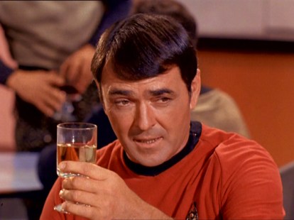 Scotty raises a glass to the Federation