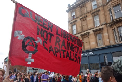 Picture of "Queer Liberation Not Rainbow Capitalism" banner at Pride Glasgow march
